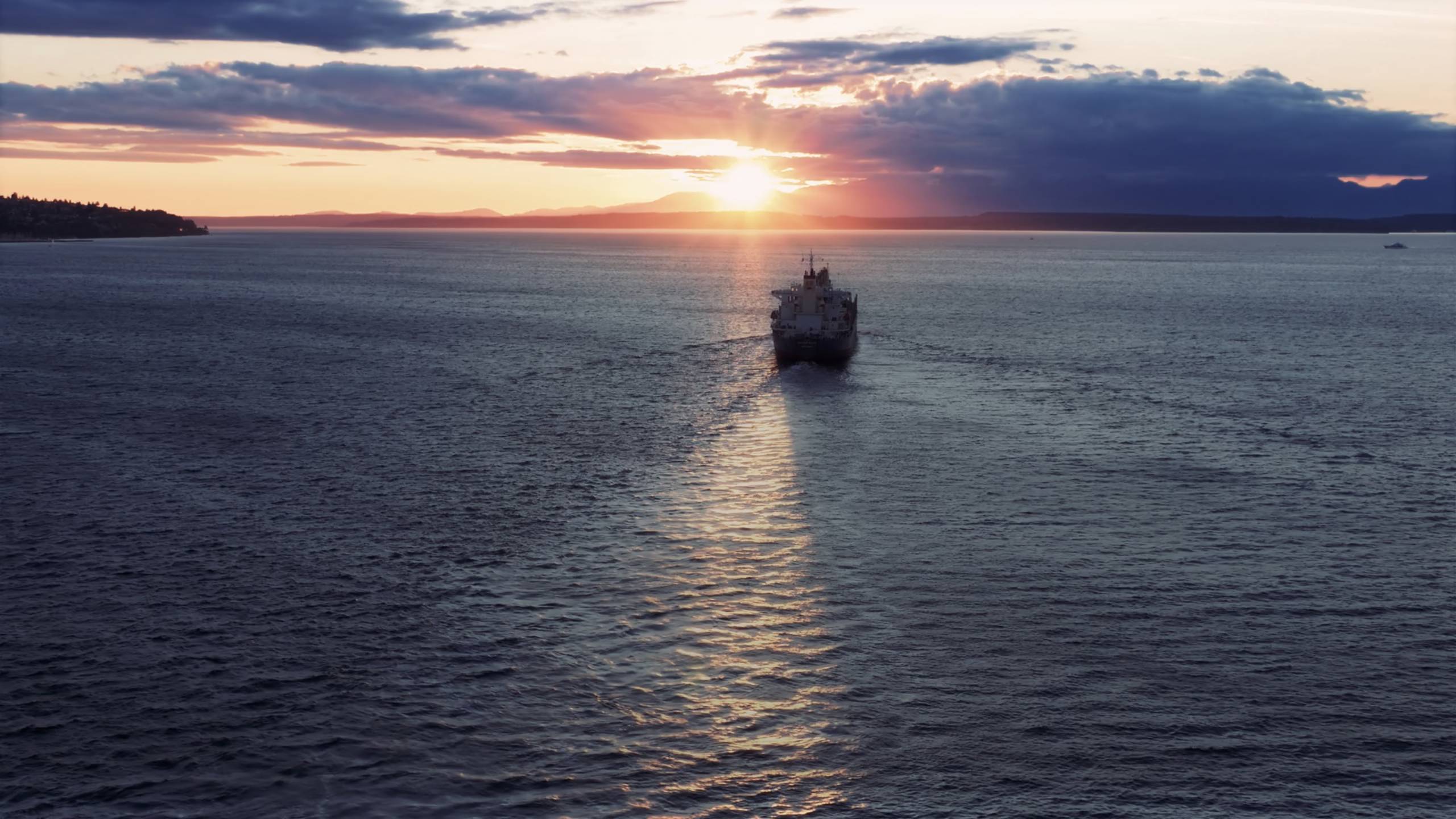 Vessel in the sea with sunset